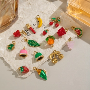 Various fruit pendants in 18K gold stainless steel including banana and strawberry shapes