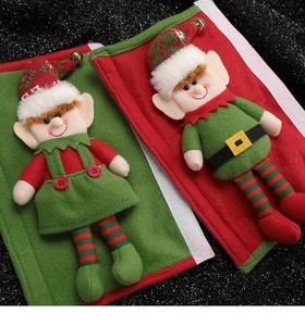 Detail of Christmas elf refrigerator handle covers with red and green knitted fabric
