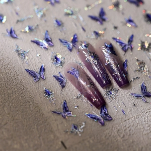 Holographic butterfly nail stickers with purple gradients and silver gothic metal patterns