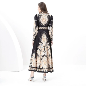 Long-sleeved vintage floral maxi dress with waist cinching and Bohemian print patterns