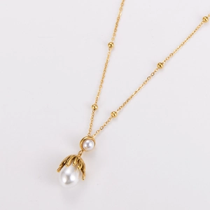 Golden bead chain necklace with double pearl octopus claw pendant on white background