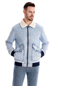 Detail of light blue denim jacket with white fleece collar and ribbed elastic cuffs