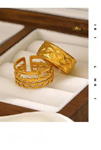 Close-up of golden vintage rings with woven texture and hollow star patterns