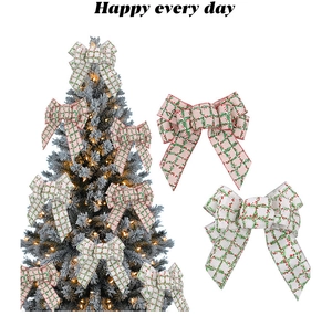 Detail of red and green plaid burlap Christmas bows on a festive holiday tree