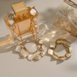 Irregular natural shell beaded double-layer necklace and bracelet set in gold stainless steel