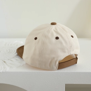 Detail view of baby cap rear with adjustable strap and premium cotton canvas texture