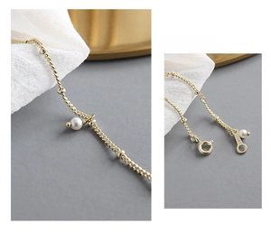 Macro detail of S925 sterling silver chain with pearls and authentic hallmark stamp