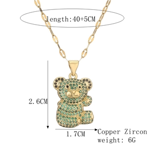 Detailed size specifications for the gold-plated teddy bear pendant with green zircons