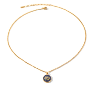 Detailed macro of golden evil eye necklace with blue enamel and colorful zircon inlay