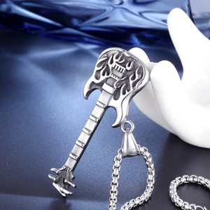 Detailed close-up of a silver stainless steel guitar pendant with flame pattern on a chain
