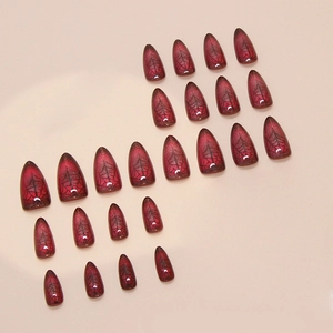 Dark red Halloween press-on nails with black spider web patterns in almond shape