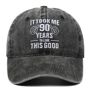 Close-up of 90th birthday embroidery on a washed vintage cotton baseball cap