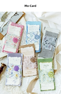 Detail of vintage decorative cards with floral borders and wax seals for scrapbooking