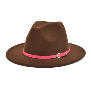Detail of dark brown wool fedora hat featuring a pink band and golden metal buckle