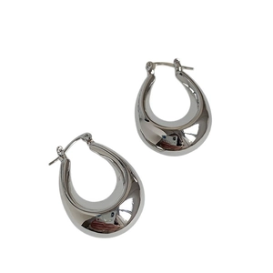 Sleek silver oval hoop earrings with a polished metallic finish on a white background