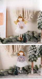 Detail of plush Christmas angel ornaments with lace wings and glittery sequin crown