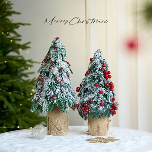 Mini Christmas trees with red berries, snow cedar texture, and burlap base for desk decor