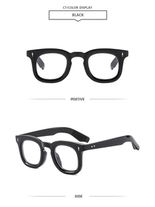 Detail of retro black square frames with silver diamond metal rivets and sturdy hinges