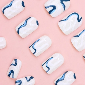 Short square press-on nails with white base and blue minimalist abstract wave patterns