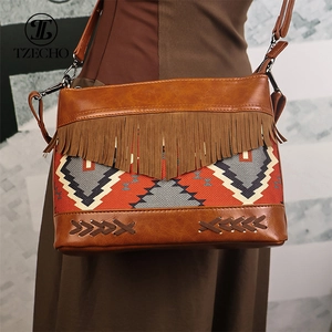 Bohemian retro crossbody bag featuring brown leather, ethnic fabric patterns, and tassels