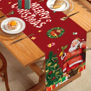 Christmas table runner with Santa Claus and Merry Christmas text on red fabric