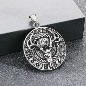 Macro shot of Nordic deer skull pendant in vintage steel finish on black box