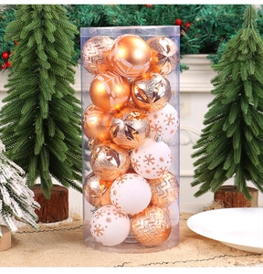 Detailed view of gold and white Christmas balls with glitter and snowflake patterns