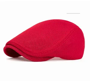 Detailed close-up of bright red mesh fabric on a breathable sun hat for outdoor use