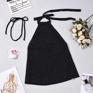 Flat lay of a sparkly black striped halter top with metallic thread detail and tie-back