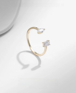 Macro view of 925 silver gold ring showing marquise and rectangular zircon details