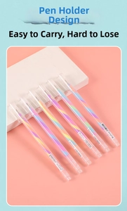 Detail view of 6 colorful gradient glitter pens neatly arranged on a pink surface