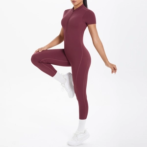 Deep burgundy short sleeve yoga jumpsuit with half-zipper and slim fit design