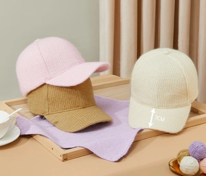 Detail shot of warm fleece-lined knitted baseball cap showing 7cm brim and soft texture