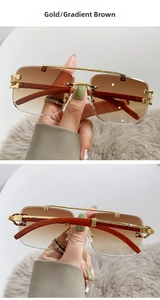 Detail of square gold metal sunglasses with gradient brown lenses and wooden temples