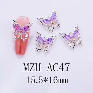 Detail view of a purple gradient 3D butterfly nail charm with silver metal frame