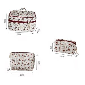 Three-piece set of cream quilted corduroy cosmetic bags with floral print in varied sizes