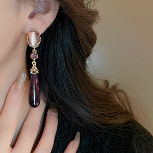 Gothic vintage gold earrings with pink gemstones and purple teardrop resin pendants