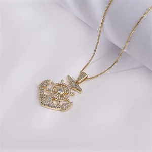 Hip hop anchor and helm pendant necklace with sparkling cubic zirconia on a gold box chain