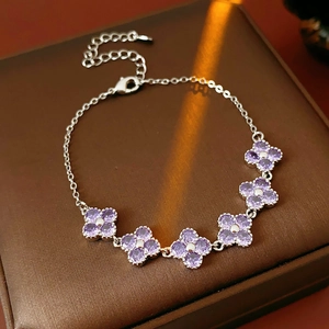 Close-up of sparkling purple zircon flower bracelet on a luxury jewelry display box