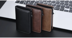 Macro detail of three vintage crazy horse leather RFID-blocking pop-up card holders