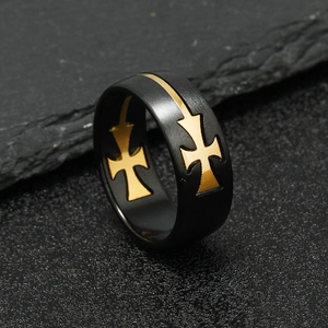 Men's punk black and gold stainless steel cross ring with matte finish on rock background
