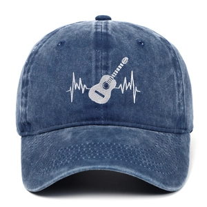 Close-up of white guitar heartbeat embroidery on washed navy blue cotton baseball cap