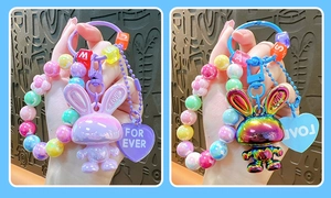 Detail of colorful acrylic bunny charms with beaded wristlet and engraved heart tags