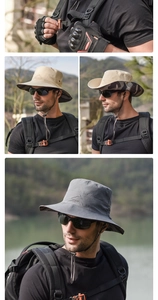 Detail of outdoor sun hat with mountain embroidery, wide brim and adjustable chin strap