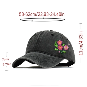 Detail view of floral embroidery on grey washed cotton baseball cap with size specs
