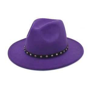 Close-up of wide-brim purple wool fedora hat with black leather rivet belt detail