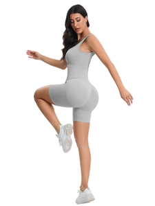 Detail of grey ribbed seamless yoga bodysuit showing high elasticity and athletic texture