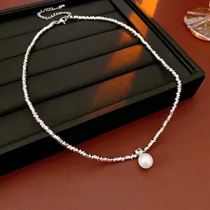 Elegant silver faceted bead necklace with a large round pearl pendant for a luxury style