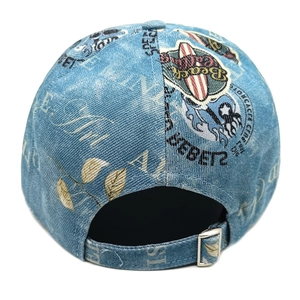 Detail view of denim baseball cap back with vintage patches and adjustable metal buckle