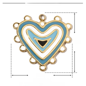 Macro shot of 20mm heart-shaped blue and white enamel pendant with stainless steel trim